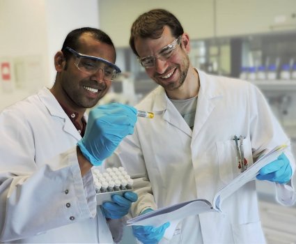 Research Chemists Teamwork Research chemists collaborating in organic chemistry laboratory