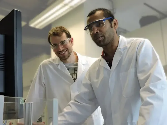 Research Chemists Evaluation Research chemists evaluating results in organic chemistry laboratory