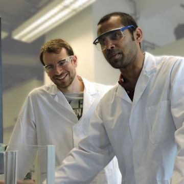 Research chemists evaluating results in organic chemistry laboratory
